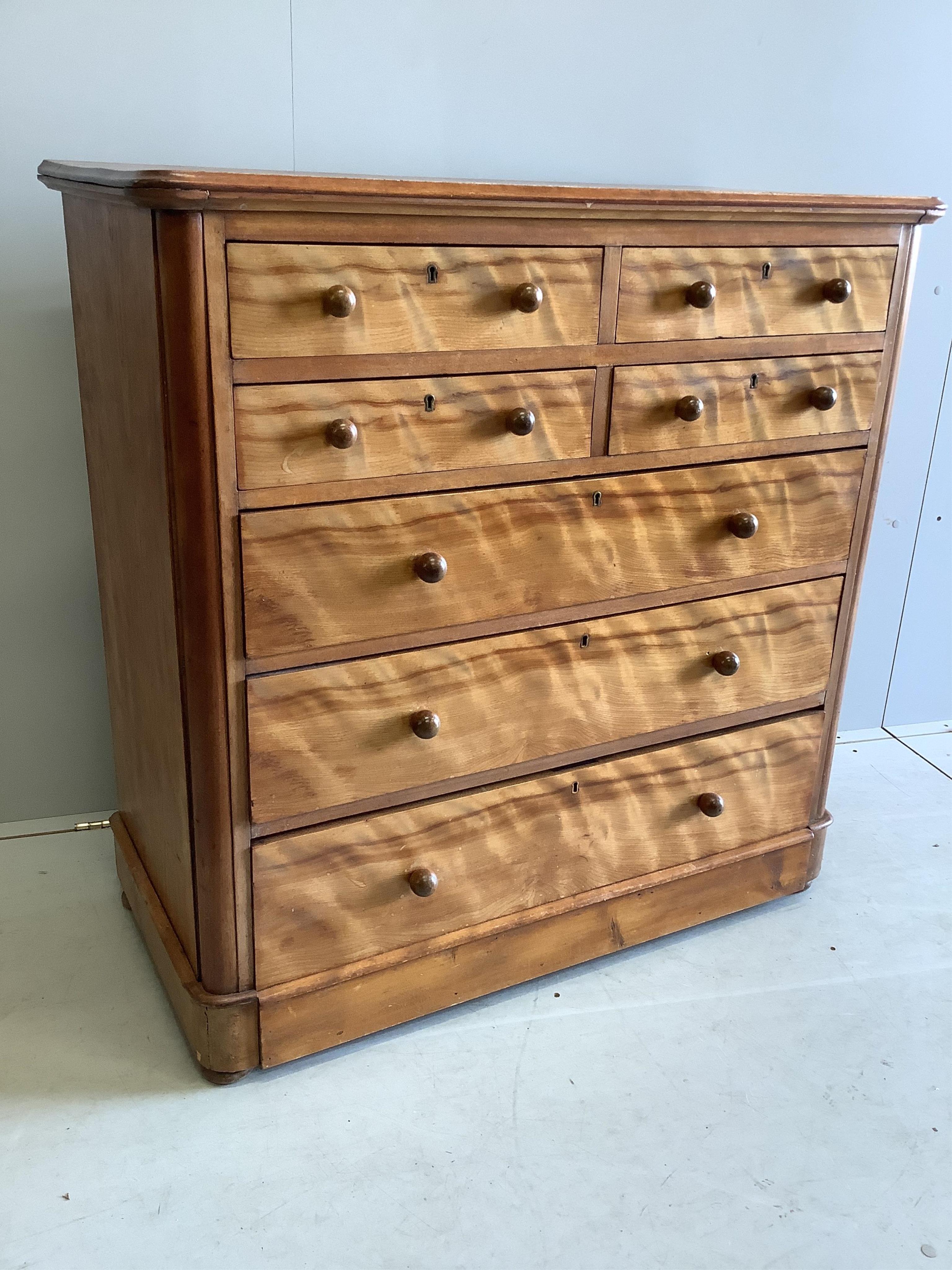 A Victorian satin birch chest of drawers, stamped Moore and Hunton, London, width 104cm, depth 51cm, height 105cm. Condition - poor to fair